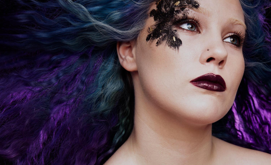 Colored hair and avant-garde makeup by student