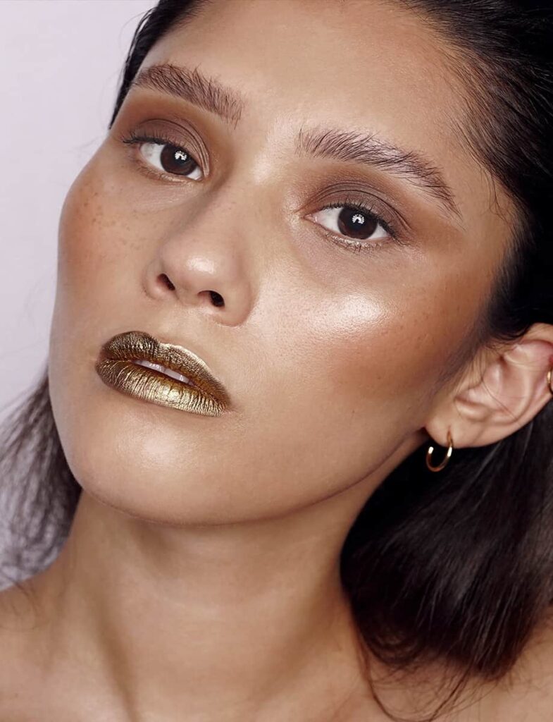 Metallic gold lip and bronze makeup